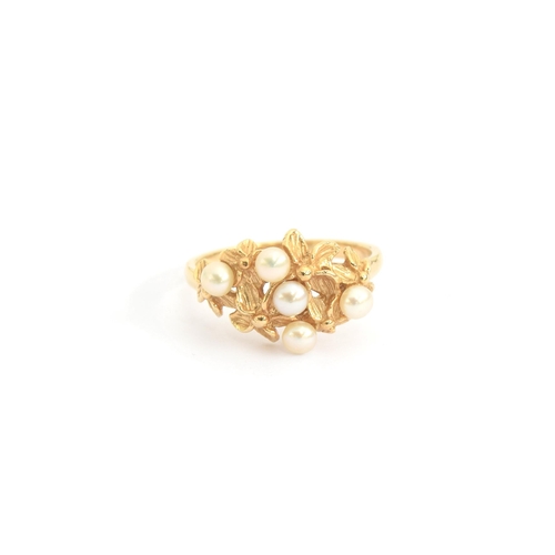 95 - A 14ct gold ring of naturalistic floral form set with pearls, size N, 3.8g