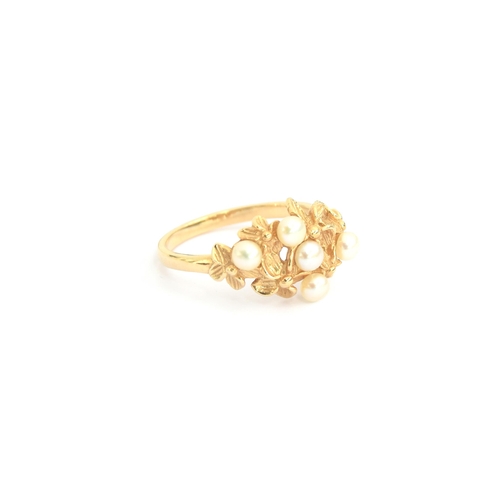 95 - A 14ct gold ring of naturalistic floral form set with pearls, size N, 3.8g