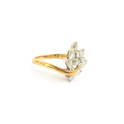 78 - An 18ct gold ring set with a leaf shaped spray of marquise and brilliant cut diamonds, size N, 4.1g