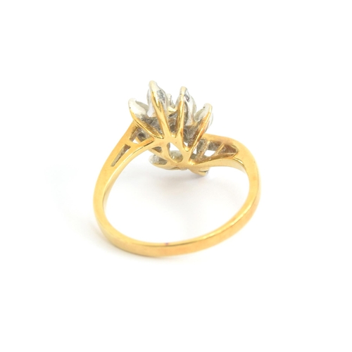 78 - An 18ct gold ring set with a leaf shaped spray of marquise and brilliant cut diamonds, size N, 4.1g