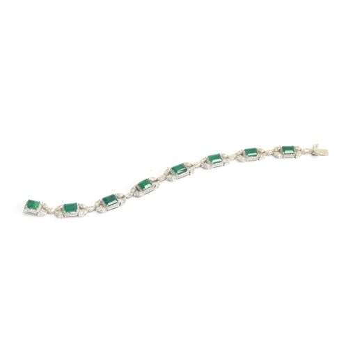 51 - An exquisite 18ct white gold emerald and diamond bracelet, the eight large emeralds approx. a total ... 