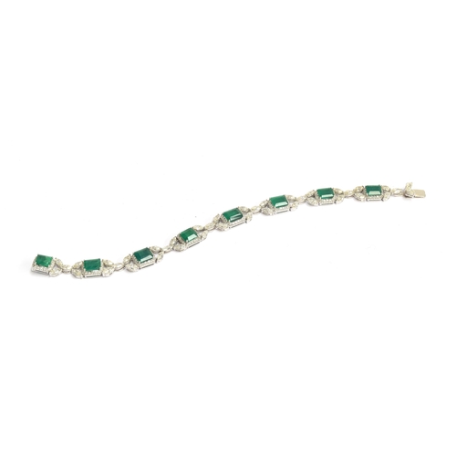 51 - An exquisite 18ct white gold emerald and diamond bracelet, the eight large emeralds approx. a total ... 