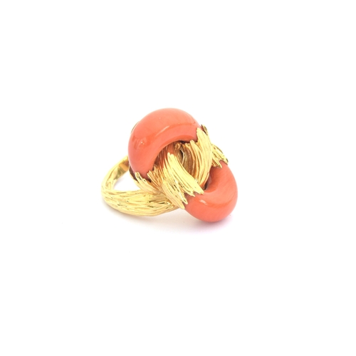 93 - A 1970s heavy 18ct gold and coral Kutchinsky ring of interlocking design, the carved coral set into ... 