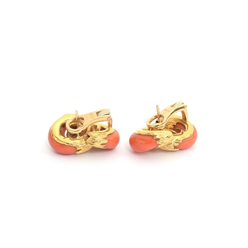 94 - A 1970s pair of heavy 18ct gold and coral Kutchinsky earrings of interlocking design, the carved cor... 