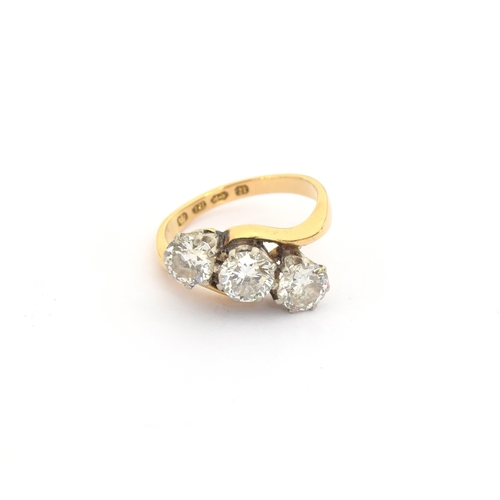 47 - An 18ct gold and diamond trilogy crossover ring, total carat weight approx. 1.6cts, size K, hallmark... 