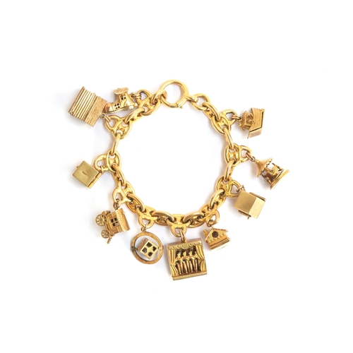 99 - An 18ct gold mariner link charm bracelet with a collection of ten 9ct novelty articulated charms, 17... 