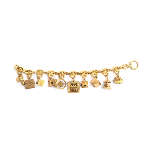 99 - An 18ct gold mariner link charm bracelet with a collection of ten 9ct novelty articulated charms, 17... 