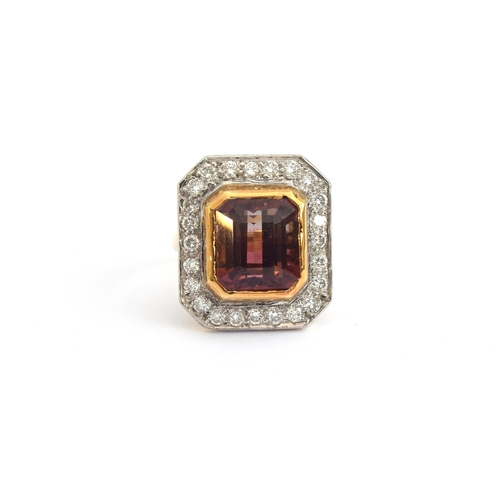 84 - An 18ct gold cluster ring set with an emerald cut bicolour pink tourmaline, approx. 8cts, surrounded... 