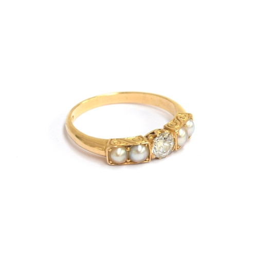 2 - A Victorian 18ct gold ring set with a central old cut diamond flanked by two pearls on each shoulder... 