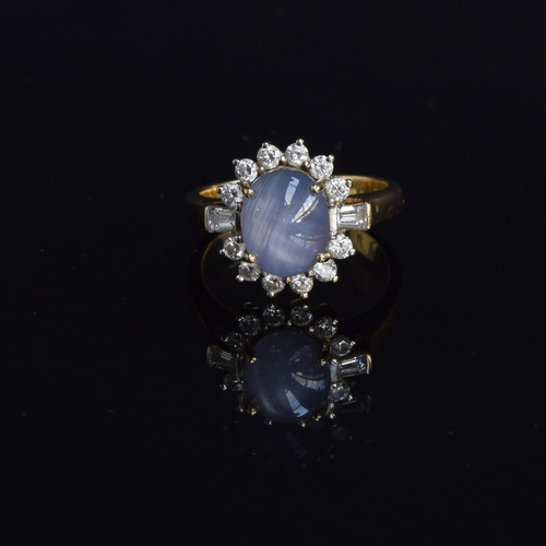 74 - An 18ct gold star sapphire and diamond cluster ring, the sapphire approx. 5cts, size Q, 8.7g