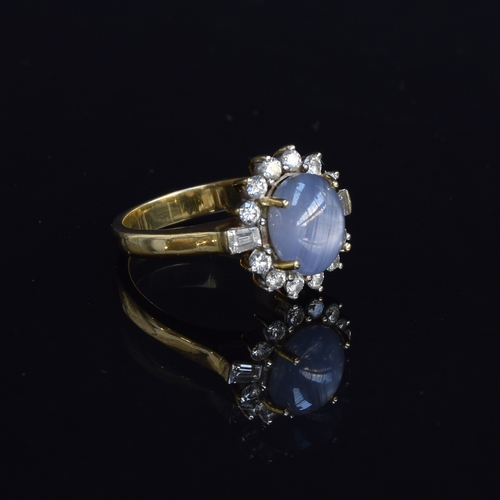 74 - An 18ct gold star sapphire and diamond cluster ring, the sapphire approx. 5cts, size Q, 8.7g