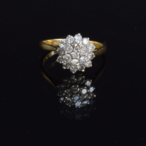 77 - An 18ct gold diamond cluster ring, the diamonds totalling approx. 1ct, size P 1/2, 4.3g