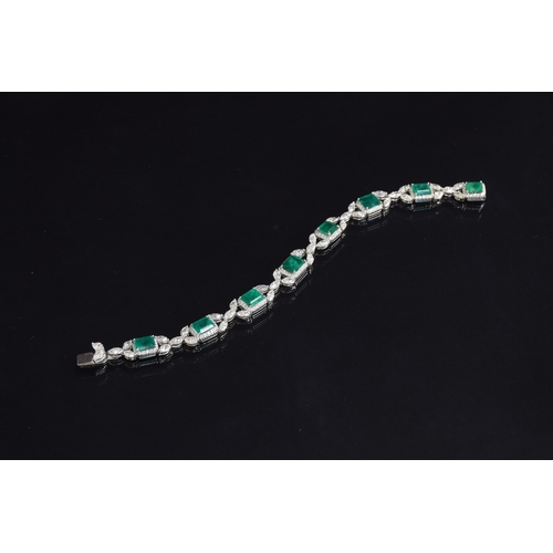 51 - An exquisite 18ct white gold emerald and diamond bracelet, the eight large emeralds approx. a total ... 