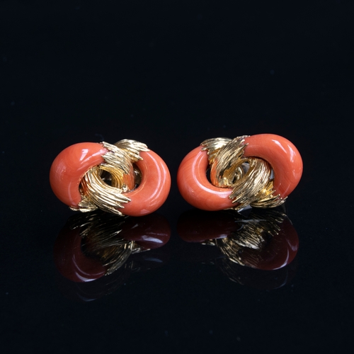 94 - A 1970s pair of heavy 18ct gold and coral Kutchinsky earrings of interlocking design, the carved cor... 