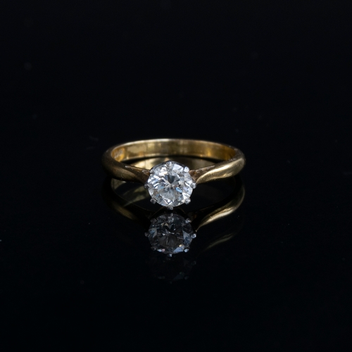 46 - An 18ct gold and platinum set diamond solitaire ring, the diamond approx. 0.7cts, size L, 2.9g