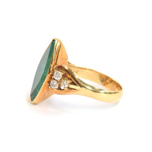 52 - An impressive 18ct yellow gold ring set with a large navette shaped emerald, estimated 9.35 carats, ... 