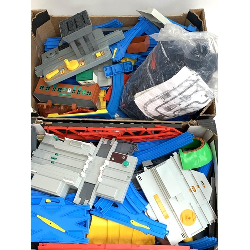 302 - Tomy: Two Boxes containing large quantity of Tomy railway tracks; points; crossings; station, etc.