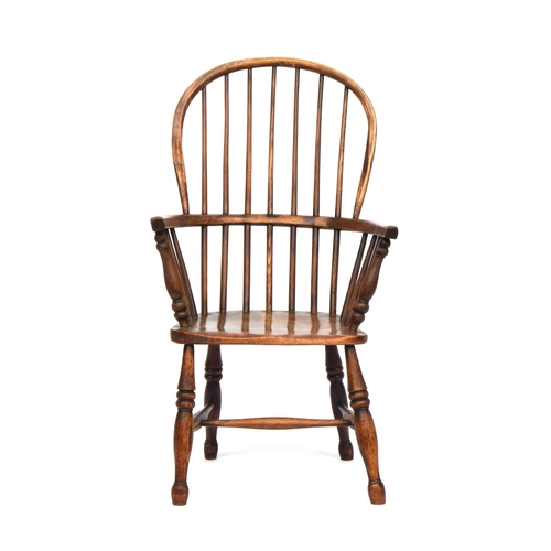 503 - A 19th century Windsor chair, ash and elm, stick back, turned underarm supports, on ring turned legs... 