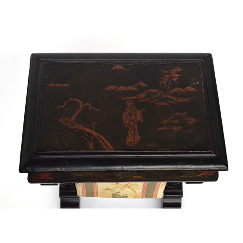 477 - A 19th century black Japanned work table, the hinged lid opening to a fitted interior, with pull out... 