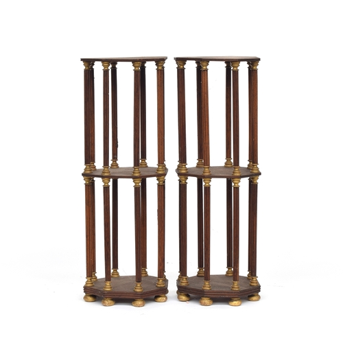 479 - A pair of mahogany and parcel gilt three tier octagonal etageres or plant stands, on reeded supports... 