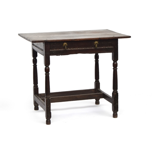 446 - A 17th century oak side table, plank top with cleated ends, single carved frieze drawer, on reel tur... 