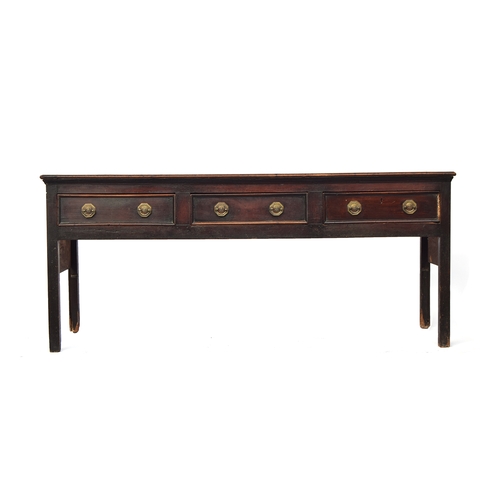 449 - An 18th century mahogany dresser base, the moulded top over three heavily cockbeaded drawers, on squ... 