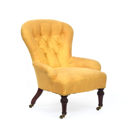 506 - A Victorian button back slipper chair by Holland & Sons, with loose cream cover, on turned front leg... 