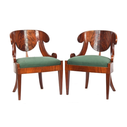 497 - A pair of mahogany Russian Biedermeier klizmos style side chairs, stuffover upholstered seats, 61cm ... 