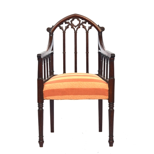 499 - A 19th century mahogany gothic open armchair in the manner of James Wyatt, the top rail as a gothic ... 