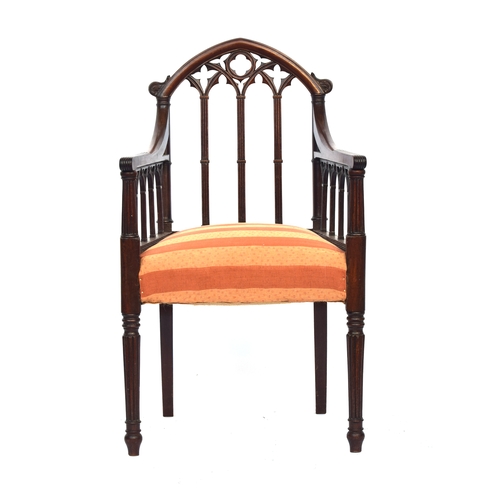 499 - A 19th century mahogany gothic open armchair in the manner of James Wyatt, the top rail as a gothic ... 