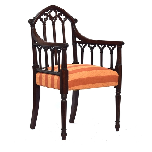 499 - A 19th century mahogany gothic open armchair in the manner of James Wyatt, the top rail as a gothic ... 