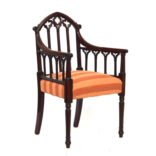 499 - A 19th century mahogany gothic open armchair in the manner of James Wyatt, the top rail as a gothic ... 