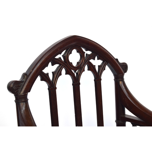 499 - A 19th century mahogany gothic open armchair in the manner of James Wyatt, the top rail as a gothic ... 