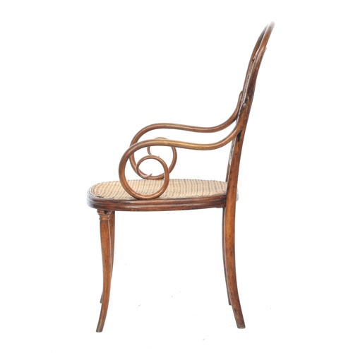 502 - A Gebrüder Thonet bentwood and caned open armchair, bears label to stretcher, 58cm wide, the seat 45... 