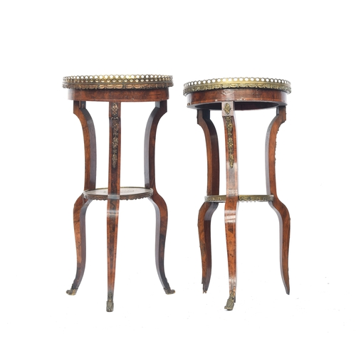 478 - A pair of Sheraton style two tier circular side tables, pierced gilt metal galleries burr walnut and... 