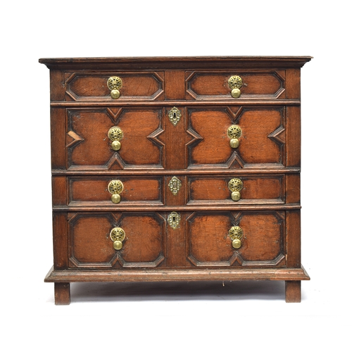 450 - A Charles II joined oak chest of drawers, moulded top over two short and three long drawers with geo... 