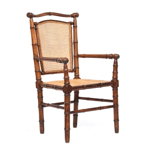 501 - A French 19th century faux bamboo open armchair, c.1880, with caned seat, approx. 59cm wide, the sea... 