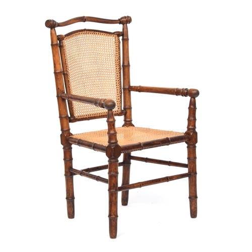 501 - A French 19th century faux bamboo open armchair, c.1880, with caned seat, approx. 59cm wide, the sea... 