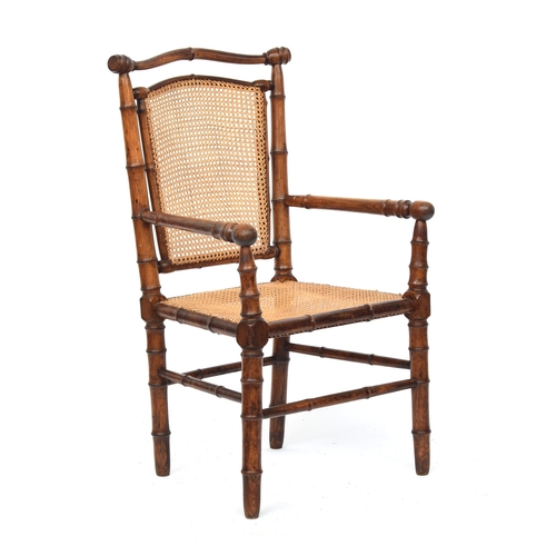 501 - A French 19th century faux bamboo open armchair, c.1880, with caned seat, approx. 59cm wide, the sea... 