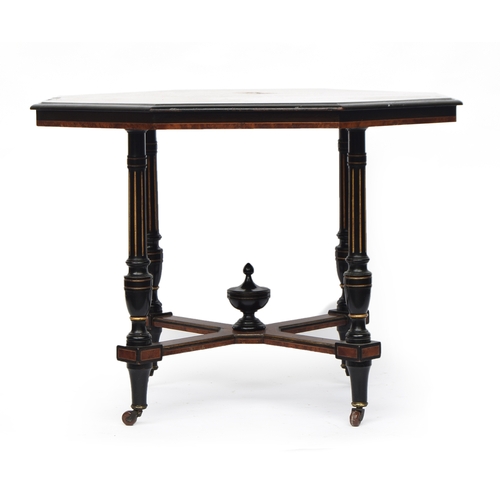 472 - A late Victorian amboyna and ebonised octagonal centre table, attributed to Gillows of Lancaster, qu... 