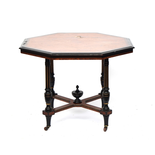 472 - A late Victorian amboyna and ebonised octagonal centre table, attributed to Gillows of Lancaster, qu... 