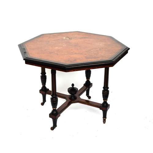 472 - A late Victorian amboyna and ebonised octagonal centre table, attributed to Gillows of Lancaster, qu... 