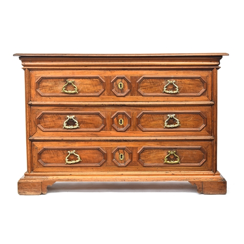 451 - A massive 17th century Italian walnut chest of drawers, heavily moulded top over three drawers with ... 