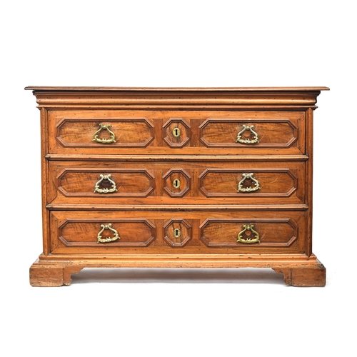 451 - A massive 17th century Italian walnut chest of drawers, heavily moulded top over three drawers with ... 