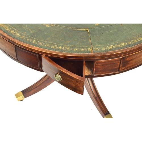 490 - A Regency mahogany drum top library table, the circular top with green leather skiver, four drawers ... 