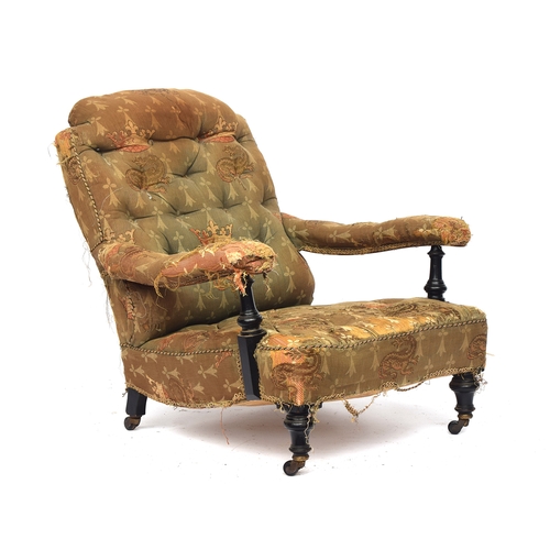 511 - A 19th century armchair in the manner of Howard & Sons, in need of reupholstery, button back, the op... 