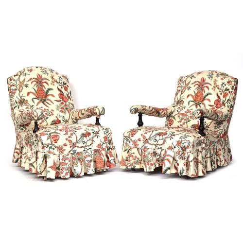 512 - A matched pair of 19th century armchairs in the manner of Howard & Sons, each with loose cover, butt... 