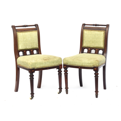 496 - A set of six Victorian gothic dining chairs, turned top rail on scroll back, with barber's pole inla... 