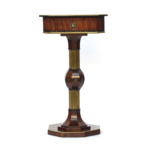 476 - A Regency walnut and brass musical sewing table, the hinged top with central mother of pearl lyre in... 