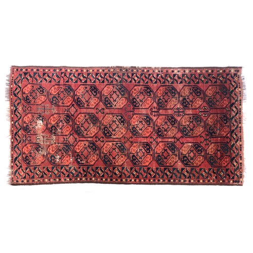 556 - A red ground Turkmen Ensari rug, 102.5x204cm